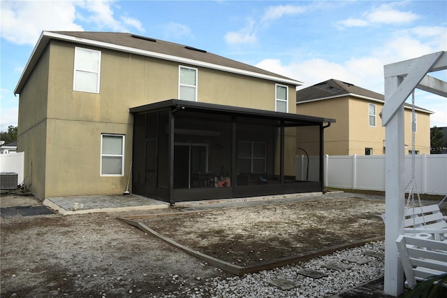 back of house with a sunroom