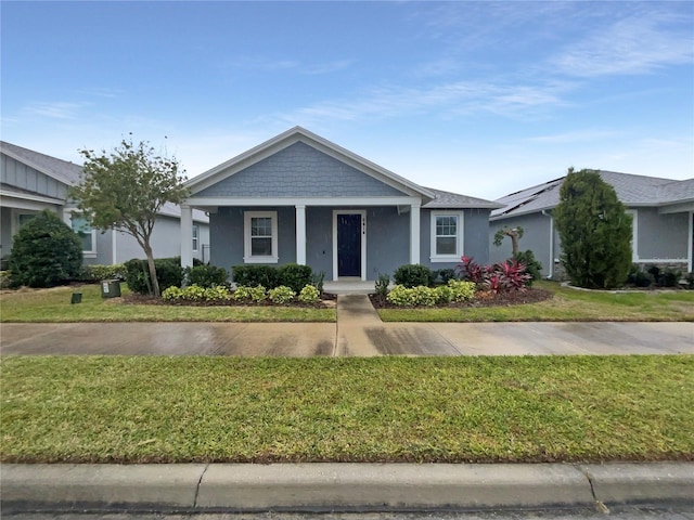 ranch-style home with a front lawn