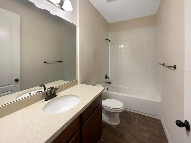 full bathroom with hardwood / wood-style floors, vanity, toilet, and shower / washtub combination