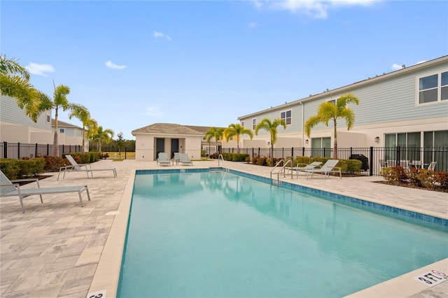 view of swimming pool with a patio area