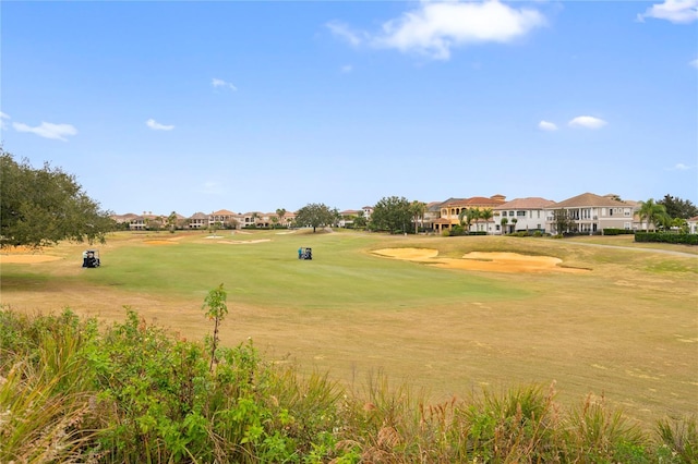 view of property's community featuring a lawn