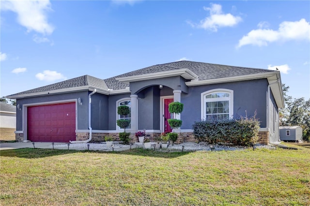 ranch-style house with a garage and a front yard