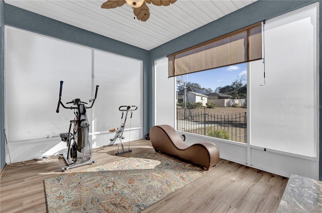 interior space with ceiling fan and wooden ceiling