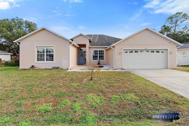 ranch-style home featuring a front yard and a garage