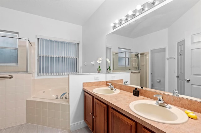 bathroom featuring tile patterned flooring, vanity, and plus walk in shower