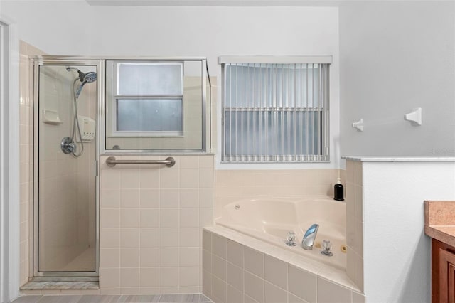 bathroom with plus walk in shower and vanity