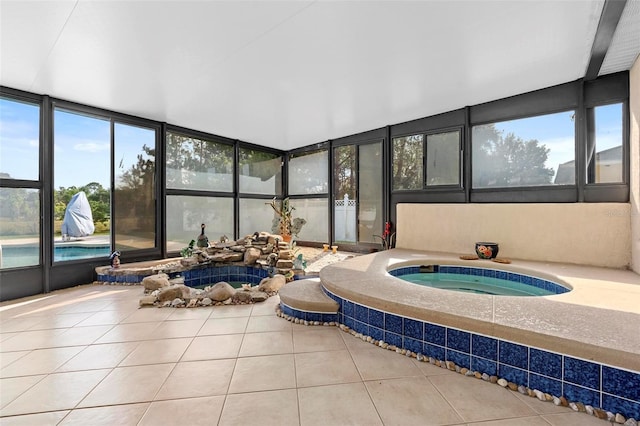 sunroom with a jacuzzi and a wealth of natural light