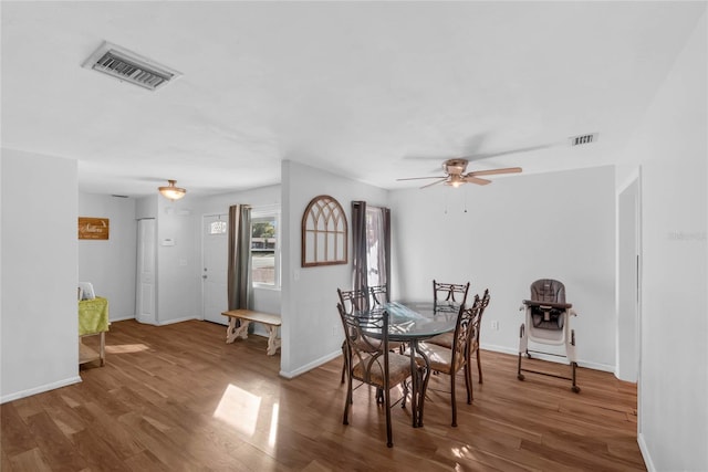 dining space featuring hardwood / wood-style flooring and ceiling fan