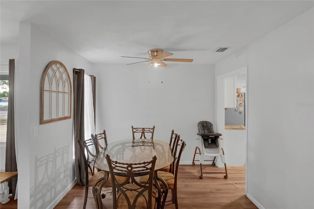 dining room featuring ceiling fan and hardwood / wood-style flooring