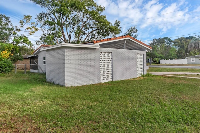 garage featuring a lawn