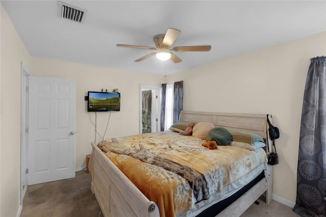 bedroom with ceiling fan and carpet floors