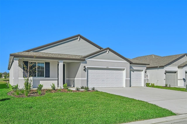 ranch-style house featuring a front lawn and a garage