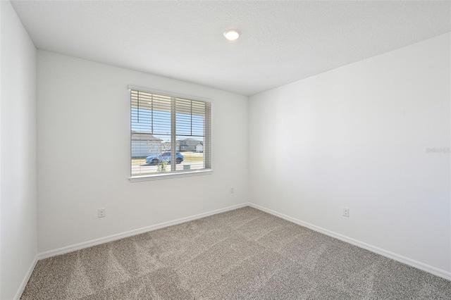 unfurnished room with carpet