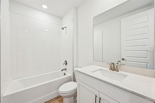 full bathroom featuring bathtub / shower combination, toilet, vanity, and wood-type flooring