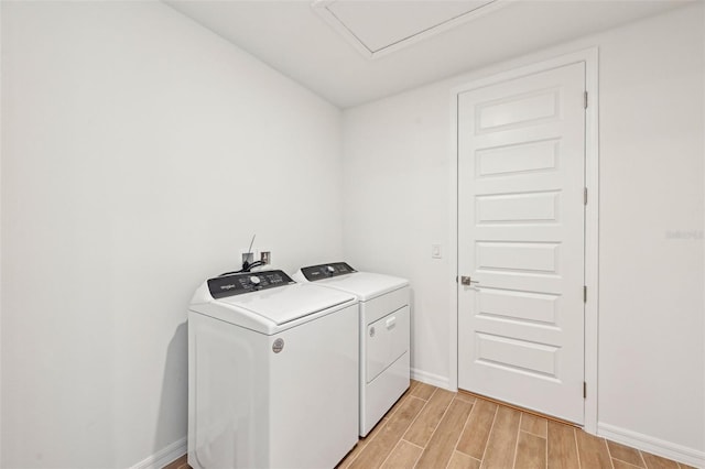 clothes washing area featuring washer and dryer