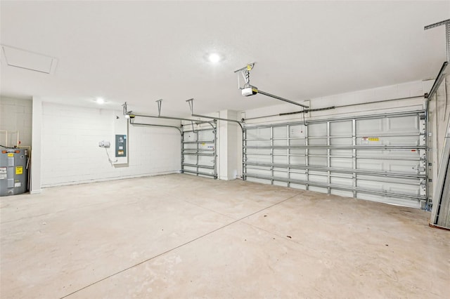 garage featuring a garage door opener, electric water heater, and electric panel