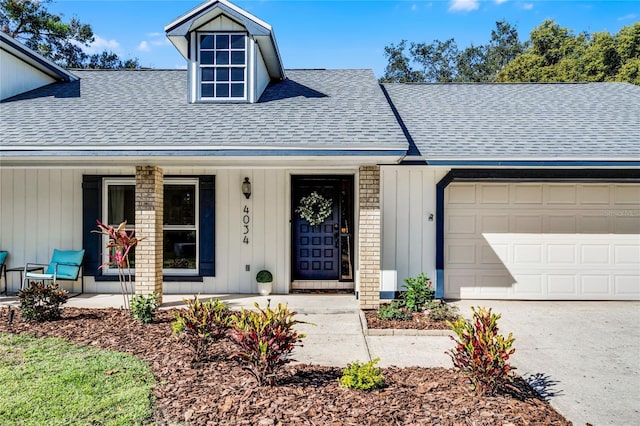 ranch-style home featuring covered porch and a garage