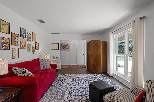 living room featuring dark wood-type flooring