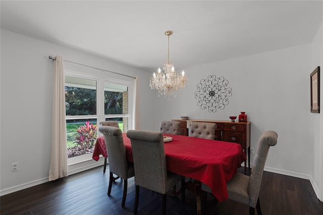 dining space featuring dark hardwood / wood-style flooring and a notable chandelier