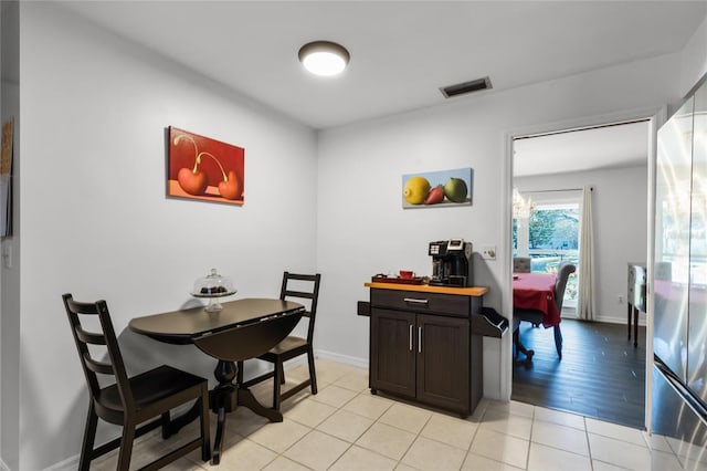 dining area featuring light tile patterned floors