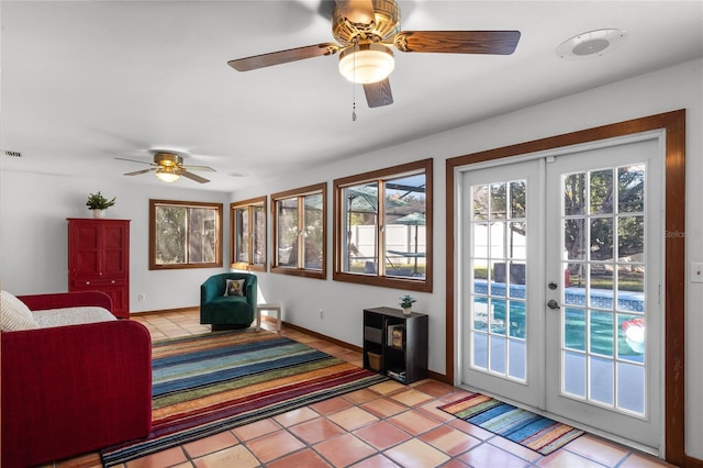 doorway featuring ceiling fan, french doors, and light tile patterned floors