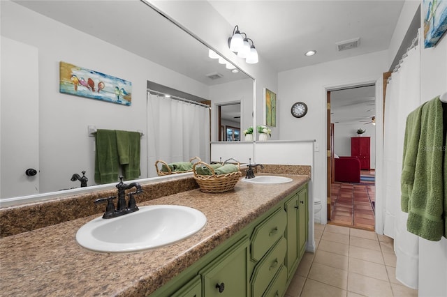 bathroom featuring tile patterned flooring, vanity, and ceiling fan