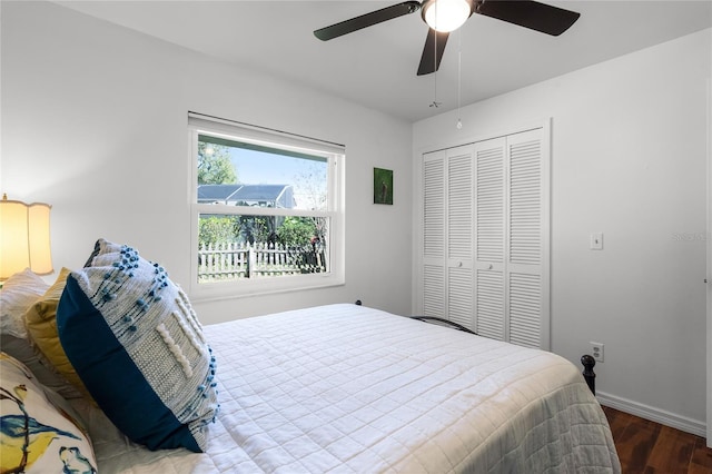 bedroom featuring ceiling fan, a closet, and wood-type flooring