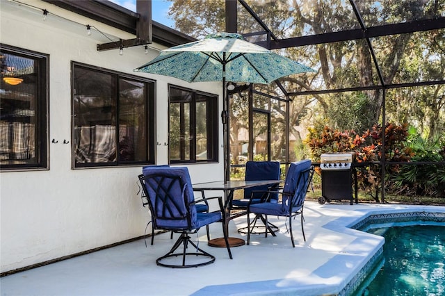 view of patio / terrace featuring area for grilling and a lanai