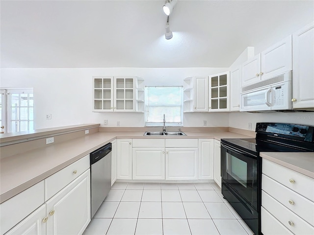 kitchen featuring sink, stainless steel dishwasher, white cabinets, and black range with electric cooktop