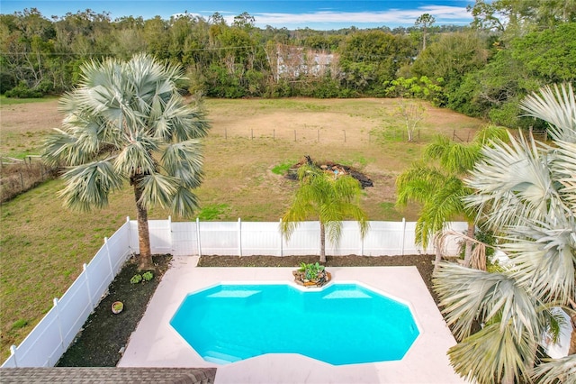 view of swimming pool with a lawn