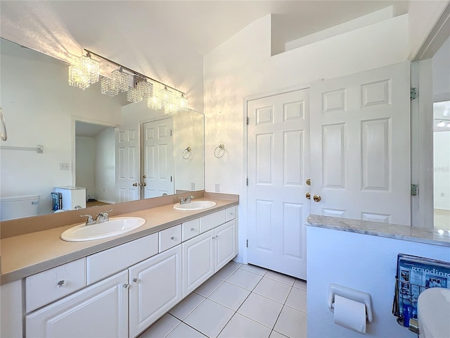 bathroom with vanity, tile patterned floors, and toilet