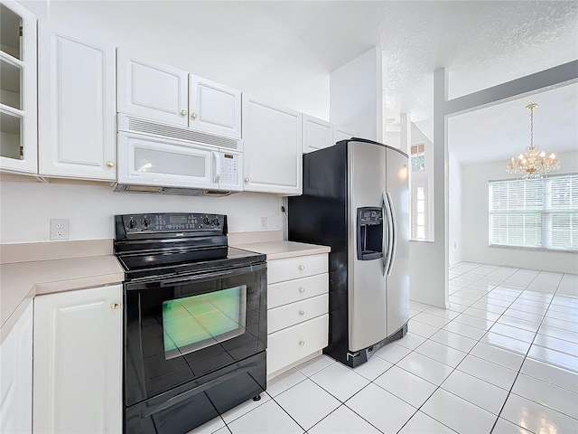 kitchen featuring black electric range oven, white cabinets, hanging light fixtures, stainless steel refrigerator with ice dispenser, and a textured ceiling