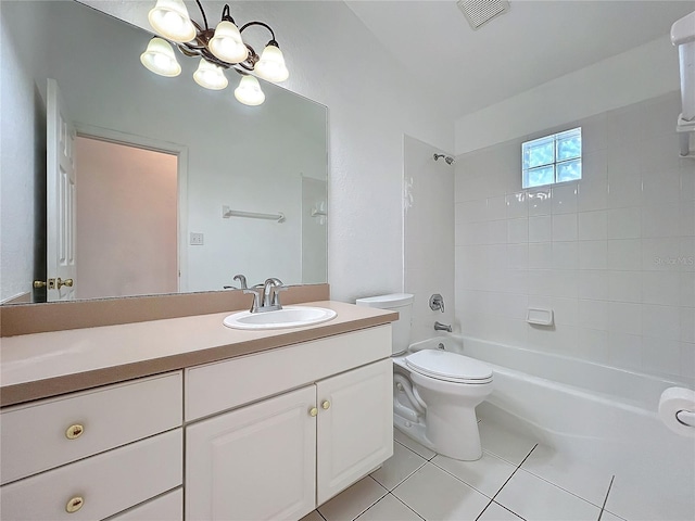 full bathroom featuring tile patterned floors, toilet, tiled shower / bath combo, and vanity