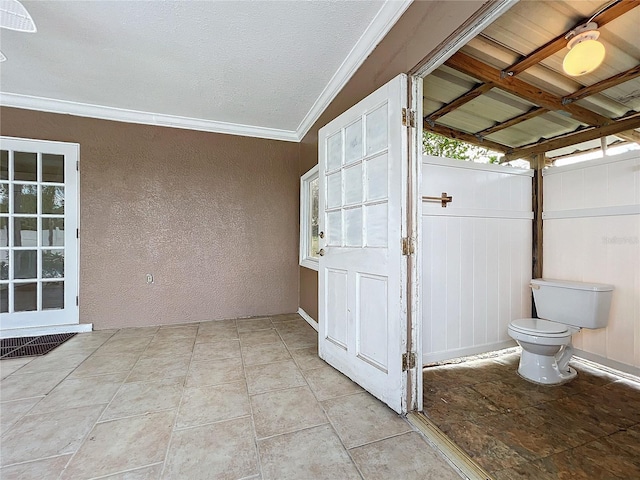 exterior space featuring ornamental molding and toilet