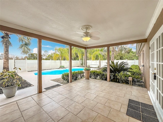 view of swimming pool with ceiling fan and a patio area