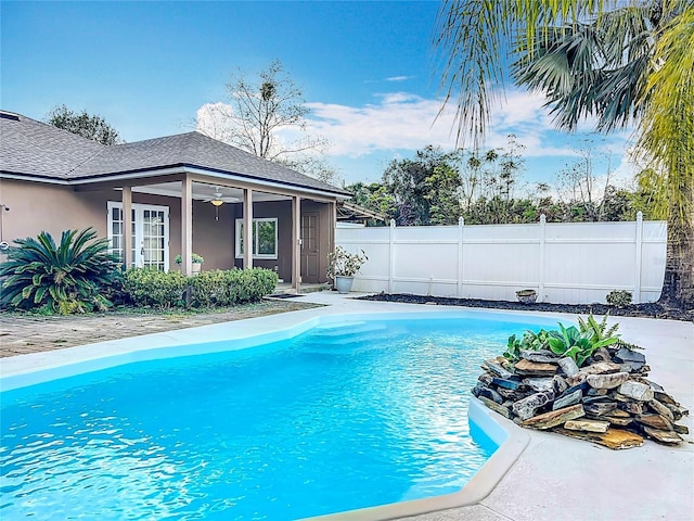 view of swimming pool with ceiling fan