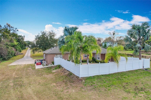 view of property exterior with a lawn