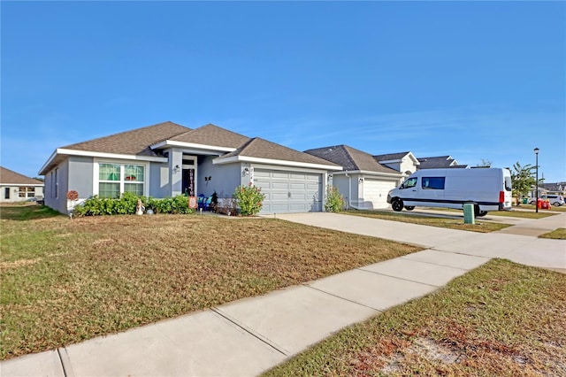 single story home featuring a front yard and a garage