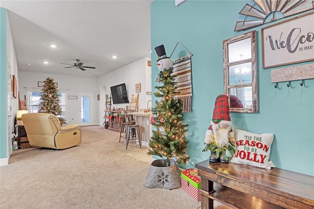 living room with carpet and ceiling fan