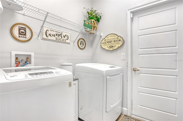 laundry room with washing machine and clothes dryer