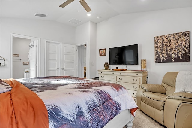 carpeted bedroom with connected bathroom, ceiling fan, and lofted ceiling