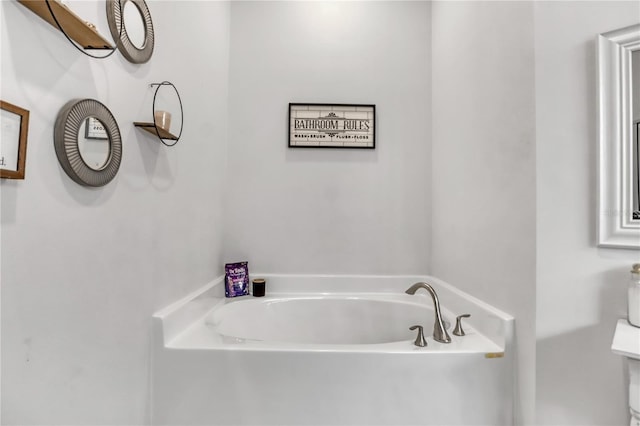 bathroom featuring a tub to relax in