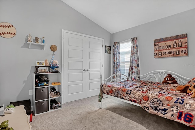 bedroom with carpet, a closet, and lofted ceiling