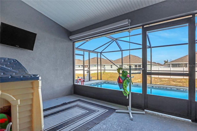 view of patio / terrace with glass enclosure and a fenced in pool