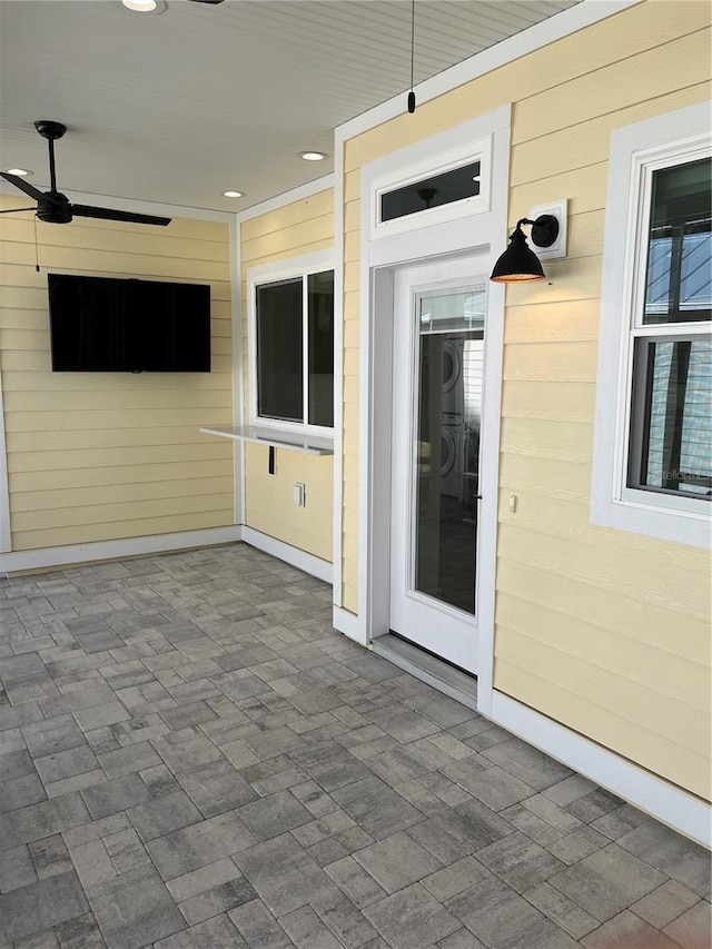 view of patio featuring ceiling fan