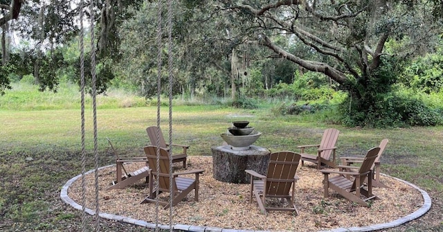 view of yard with a fire pit