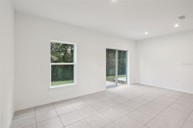 unfurnished room with light tile patterned floors