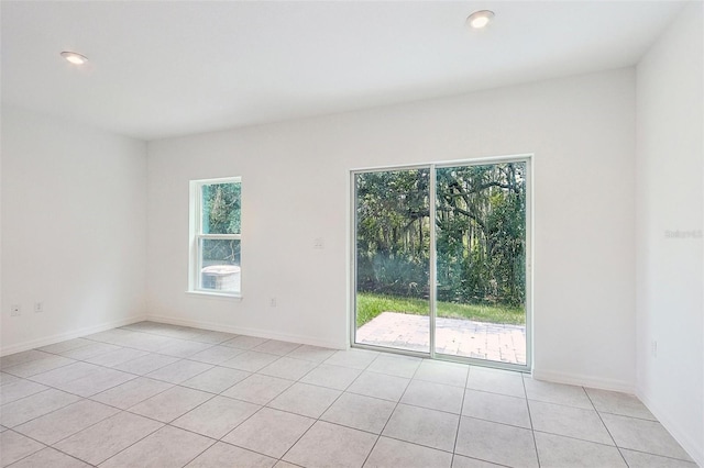 empty room featuring light tile patterned floors