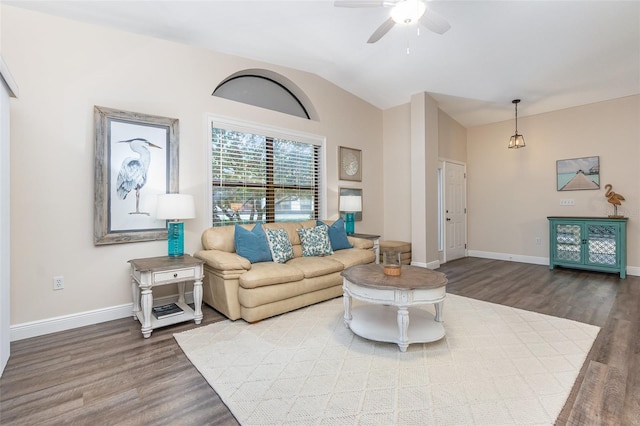 living room with hardwood / wood-style floors, vaulted ceiling, and ceiling fan