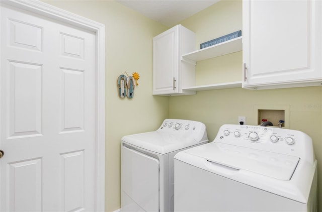 laundry room with cabinets and independent washer and dryer